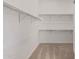 Spacious walk-in closet with ample shelving and hanging rods at 13637 W Hackamore Dr, Peoria, AZ 85383