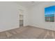 Spacious bedroom with a large window and closet at 13637 W Hackamore Dr, Peoria, AZ 85383