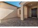 Inviting front entry with covered patio and paved courtyard at 13637 W Hackamore Dr, Peoria, AZ 85383