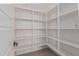 Walk-in pantry with ample shelving for storage at 13637 W Hackamore Dr, Peoria, AZ 85383