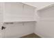 Built-in shelving and hanging rods in this closet at 13637 W Hackamore Dr, Peoria, AZ 85383