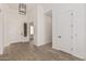 Bright entryway with wood floors and white doors at 13637 W Hackamore Dr, Peoria, AZ 85383