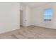 Well-lit bedroom featuring a large window and door to closet at 13637 W Hackamore Dr, Peoria, AZ 85383
