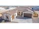 Front view of single-story home with tile roof, two-car garage, and casita at 13637 W Hackamore Dr, Peoria, AZ 85383