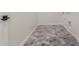 Laundry room with hexagon tile floor and built-in storage at 13637 W Hackamore Dr, Peoria, AZ 85383