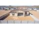 Aerial view of house showcasing backyard, block wall, and desert landscape at 13637 W Hackamore Dr, Peoria, AZ 85383