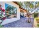 Private patio with lush landscaping and seating area at 36106 N Desert Tea Dr, San Tan Valley, AZ 85140