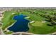 Golf course with a large lake and green fairways at 36106 N Desert Tea Dr, San Tan Valley, AZ 85140