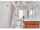 Clean bathroom with a shower/tub combo and wood vanity at 36106 N Desert Tea Dr, San Tan Valley, AZ 85140