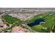 Luxury homes surrounding a golf course with lakes and walking paths at 36106 N Desert Tea Dr, San Tan Valley, AZ 85140