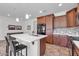 Spacious kitchen with island, stainless steel appliances, and wood cabinets at 36106 N Desert Tea Dr, San Tan Valley, AZ 85140
