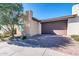 Attractive front yard with a mature tree and brick driveway at 36106 N Desert Tea Dr, San Tan Valley, AZ 85140