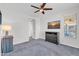 Spacious bedroom with ceiling fan, large window, dresser, and access to hallway at 36106 N Desert Tea Dr, San Tan Valley, AZ 85140