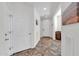 Bright entryway with tiled floors and neutral walls at 36106 N Desert Tea Dr, San Tan Valley, AZ 85140