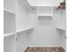 Large walk-in closet with double hanging rods and shelving at 36106 N Desert Tea Dr, San Tan Valley, AZ 85140