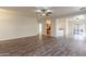 Spacious living room with wood-look flooring and ceiling fan at 453 E Taylor Trl, San Tan Valley, AZ 85143