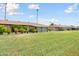 View of backyard, grassy area, and neighboring homes at 11133 W Cameo Dr, Sun City, AZ 85351