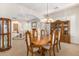 Formal dining room with wood table and hutch at 3659 E Louise Dr, Phoenix, AZ 85050