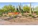 Community entrance with desert landscaping and signage at 3659 E Louise Dr, Phoenix, AZ 85050