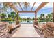 Relaxing gazebo overlooking a peaceful lake with benches and scenic views at 4053 S Skyline Ct, Gilbert, AZ 85297