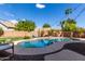 Inviting kidney-shaped pool with surrounding landscaping at 4053 S Skyline Ct, Gilbert, AZ 85297