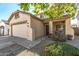 Two-story house with attached garage and landscaping at 18533 W Sanna St, Waddell, AZ 85355