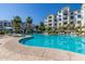 Relaxing freeform swimming pool with lounge chairs at 2511 W Queen Creek Rd # 205, Chandler, AZ 85248