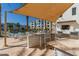 Outdoor kitchen with granite counter and shade at 2511 W Queen Creek Rd # 205, Chandler, AZ 85248