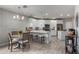 Eat-in kitchen with white cabinets, an island, and a breakfast nook at 2511 W Queen Creek Rd # 205, Chandler, AZ 85248