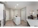 Kitchen island and white cabinets are featured in this open concept kitchen at 2511 W Queen Creek Rd # 205, Chandler, AZ 85248