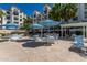 Outdoor grilling area with tables and umbrellas at 2511 W Queen Creek Rd # 205, Chandler, AZ 85248