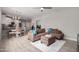 Open living room with modern furniture and kitchen view at 2511 W Queen Creek Rd # 205, Chandler, AZ 85248