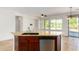 Kitchen island with granite countertop and stainless steel dishwasher at 4548 E Carob Dr, Gilbert, AZ 85298