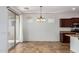 Dining area with tile floors and sliding door to patio at 4548 E Carob Dr, Gilbert, AZ 85298