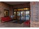 Community center entrance with seating and directional signage at 4548 E Carob Dr, Gilbert, AZ 85298