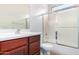 Clean bathroom with a tub shower combo and wood vanity at 4548 E Carob Dr, Gilbert, AZ 85298