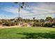 Landscaped area with a grassy lawn and parking lot at 4548 E Carob Dr, Gilbert, AZ 85298