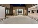 Elegant home exterior featuring a stone facade and a modern glass front door at 9989 E Aleka Way # 337, Scottsdale, AZ 85262