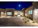 Elegant entryway with stone detailing and landscape lighting at 9989 E Aleka Way # 337, Scottsdale, AZ 85262