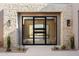 Modern front door with a sleek black frame and glass panels at 9989 E Aleka Way # 337, Scottsdale, AZ 85262