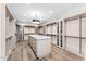 Large walk-in closet with custom shelving and island at 9989 E Aleka Way # 337, Scottsdale, AZ 85262