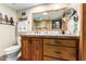 Bathroom features wood cabinets and a large vanity mirror at 16510 E Palisades Blvd # 35, Fountain Hills, AZ 85268