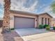 Two-car garage with stone and stucco exterior at 1841 E Gary Way, Phoenix, AZ 85042