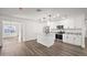Modern kitchen with white cabinets, granite counters and island at 1173 E Cordova Ave, Casa Grande, AZ 85122