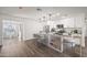 Modern kitchen with island, white cabinets, and granite countertops at 1173 E Cordova Ave, Casa Grande, AZ 85122