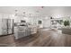 Modern kitchen with island, stainless steel appliances, and granite countertops at 1173 E Cordova Ave, Casa Grande, AZ 85122