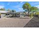 Backyard of the house with gravel and mature tree at 1173 E Cordova Ave, Casa Grande, AZ 85122