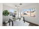 Home office featuring large windows, a glass desk, and stylish rug at 1173 E Cordova Ave, Casa Grande, AZ 85122