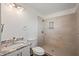 Bathroom with granite countertop, updated shower, and tile flooring at 1173 E Cordova Ave, Casa Grande, AZ 85122