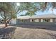 Single story home with gray exterior and landscaped yard at 1173 E Cordova Ave, Casa Grande, AZ 85122